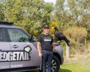 Josh holding a Wedgetail eagle whilst standing beside the Wedgetail roof rack