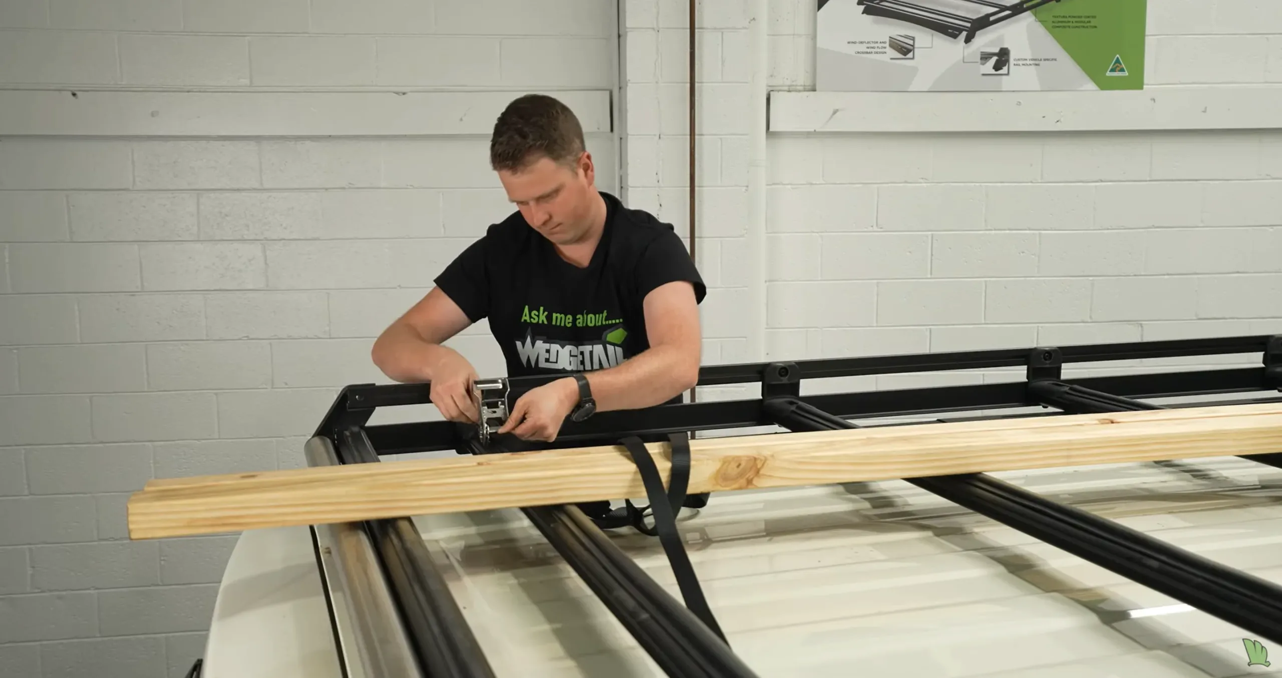 Josh securing timber to a Wedgetail Trade rack with ratchet straps